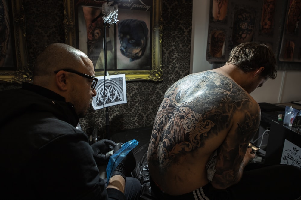 man with tattoo on back