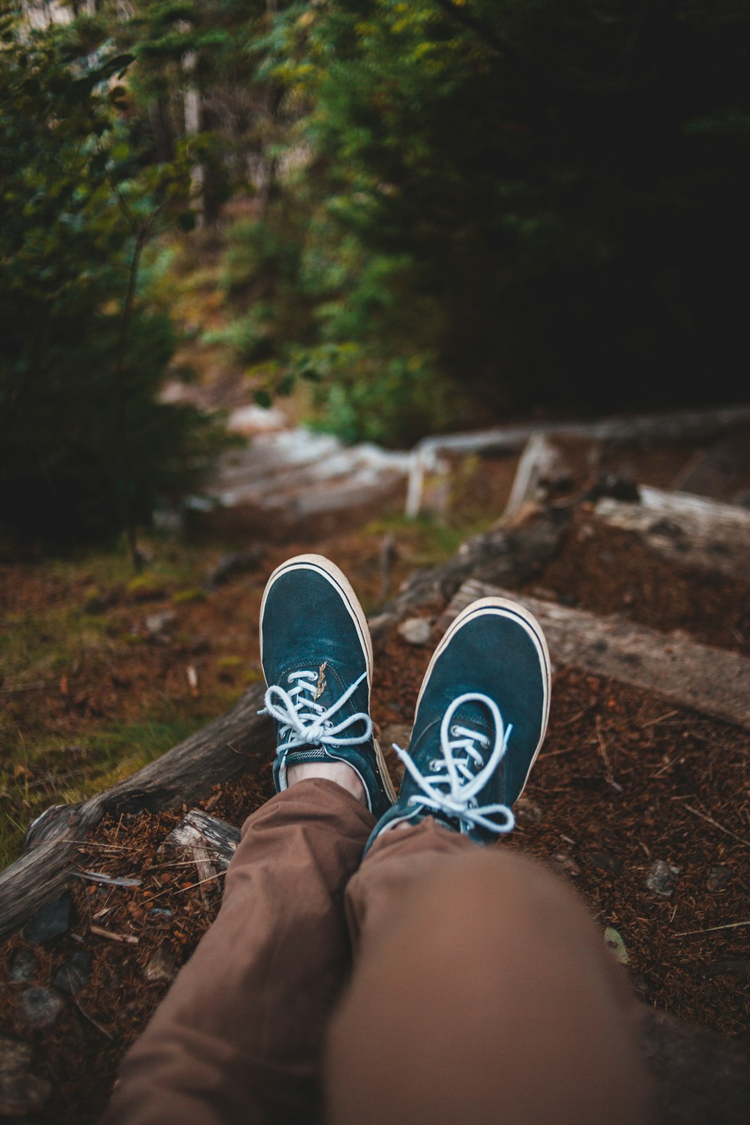 pair of blue-and-white sneakers close-up photography