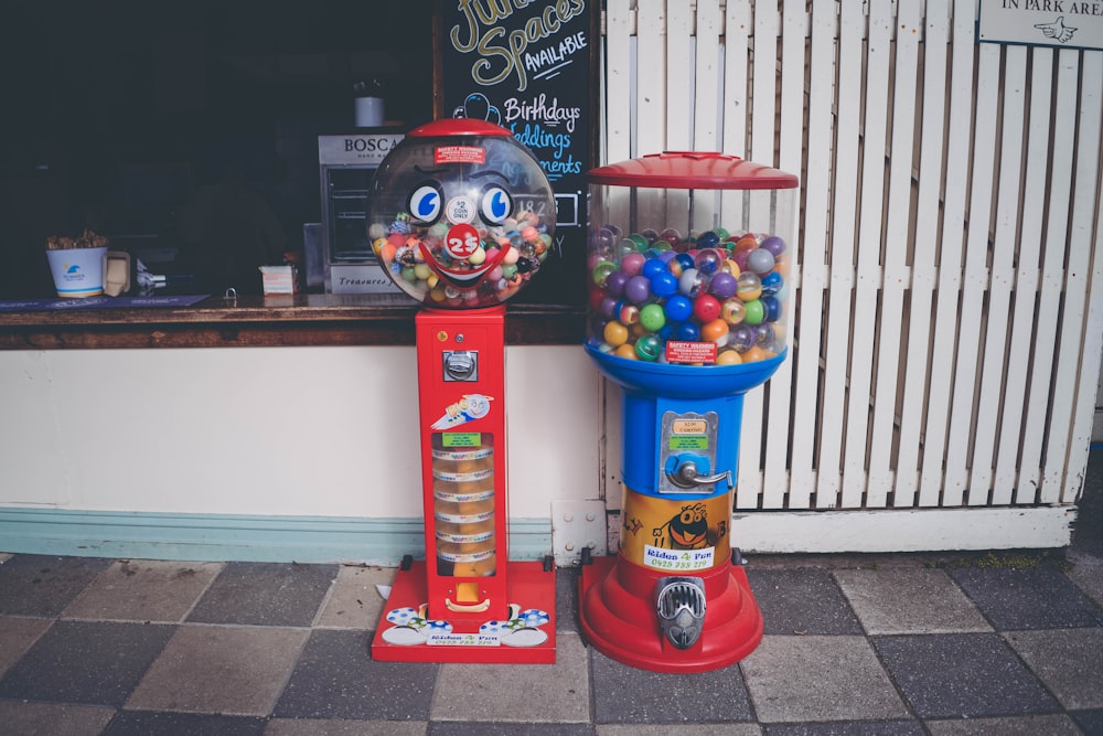 two red and blue candy dispensers