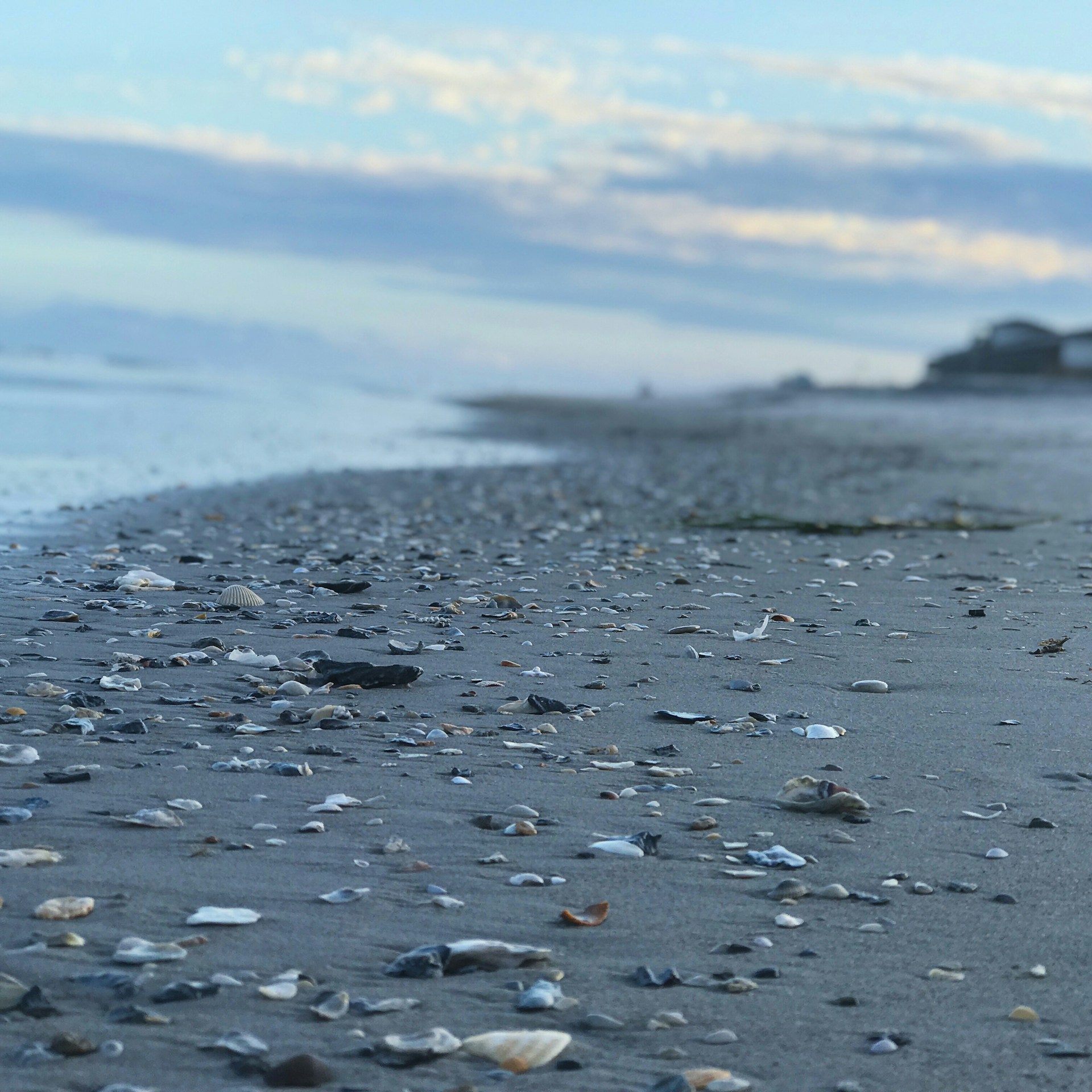 woman wearing yellow long-sleeved dress under white clouds and blue sky during daytime