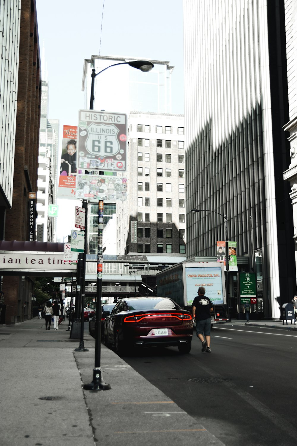 person walking beside car