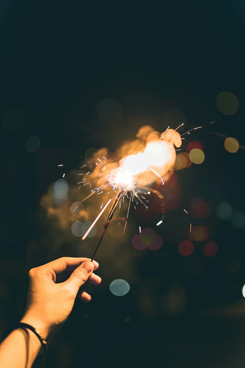 person holding sparkler