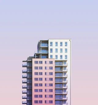 a tall building with balconies on top of it
