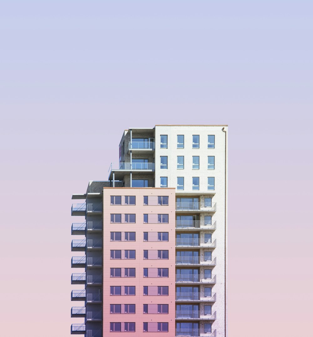 a tall building with balconies on top of it