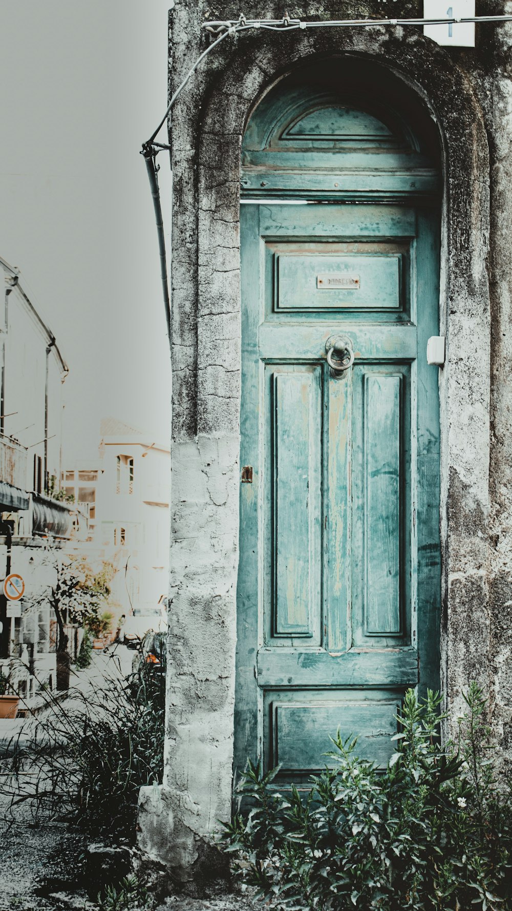 green wooden panel door