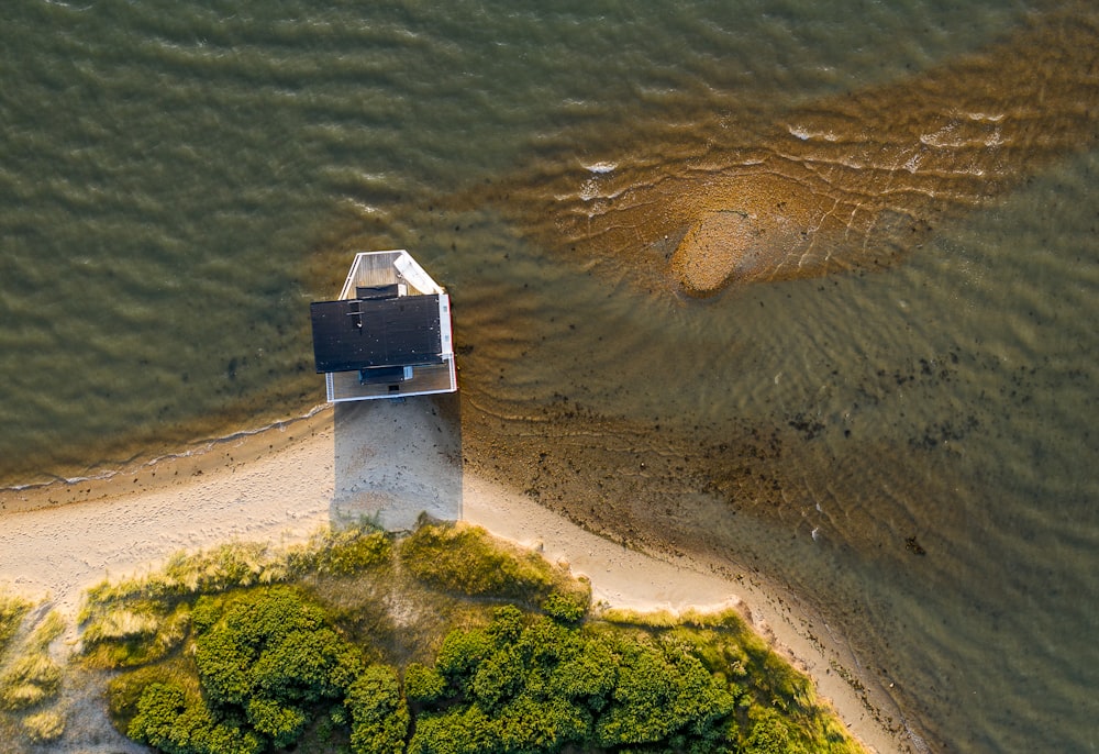 aerial photography of house on seashore