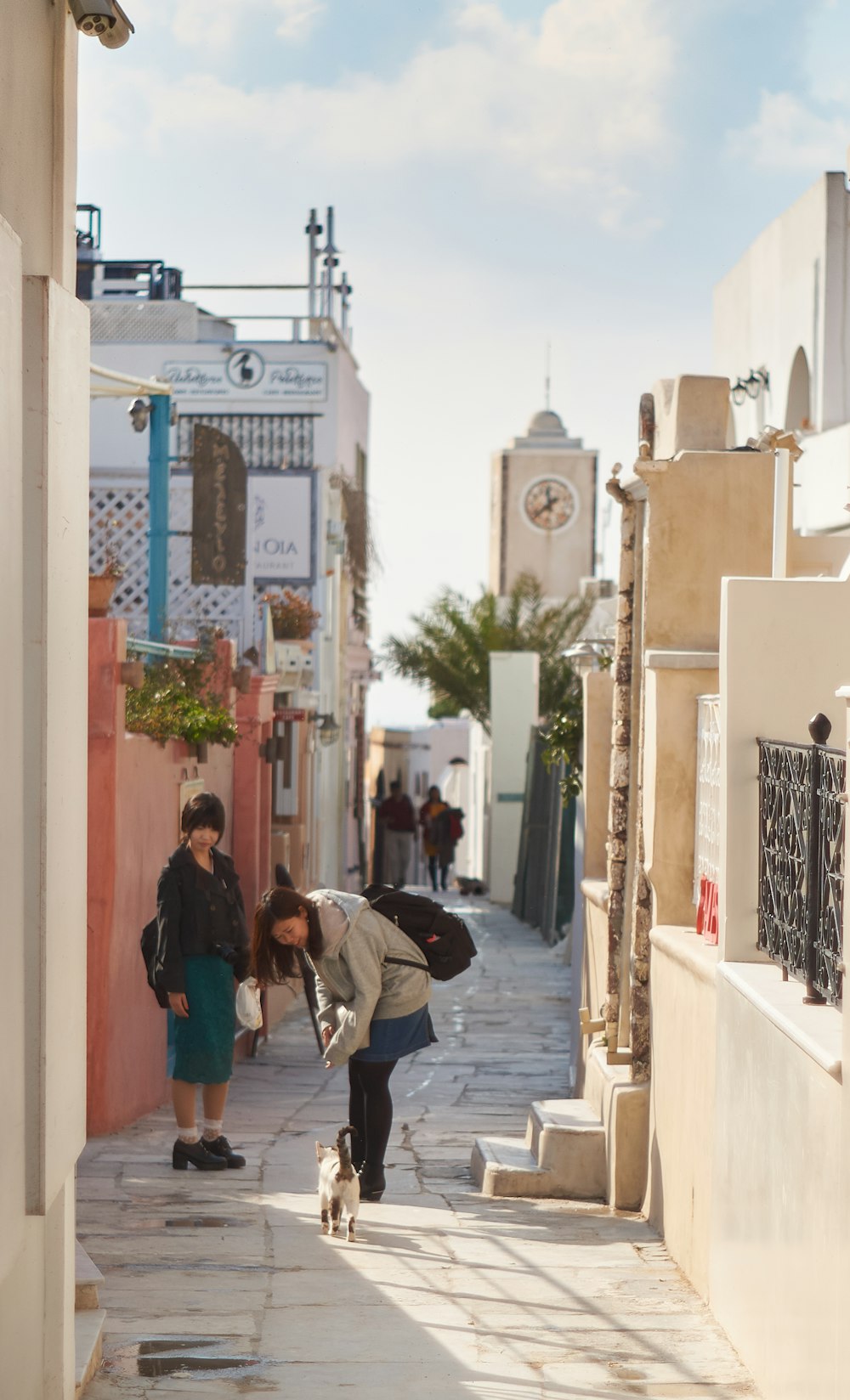 man and woman standing near buildings