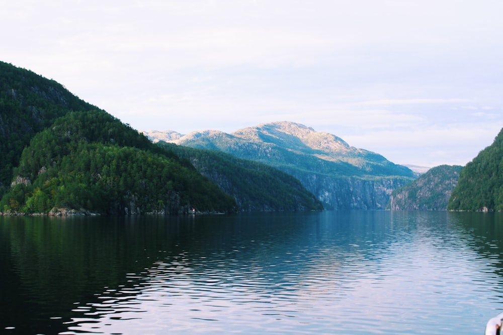 body of water surrounded by mountains