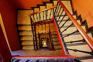 gray staircase with brown wooden railings