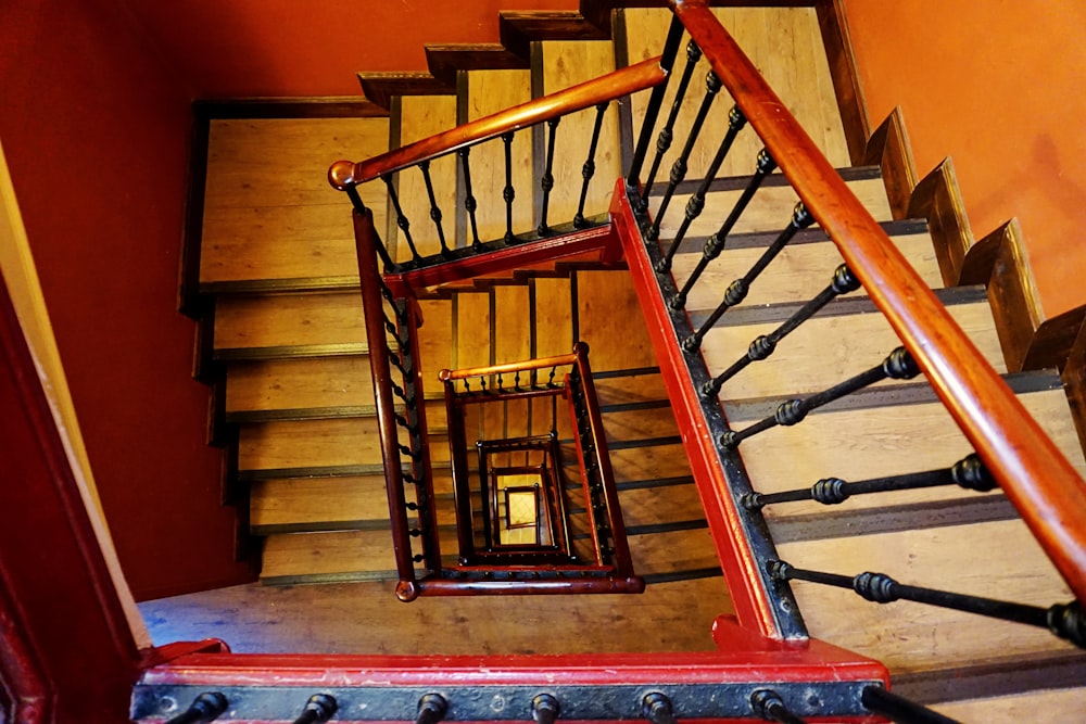 gray staircase with brown wooden railings