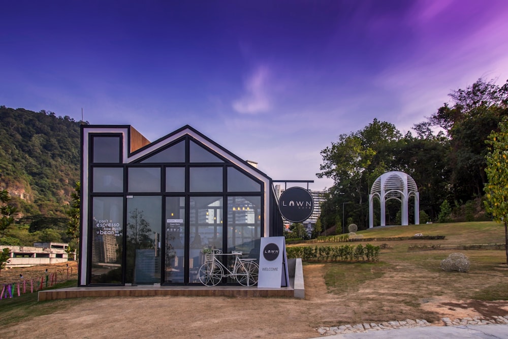 black and clear glass greenhouse during daytime