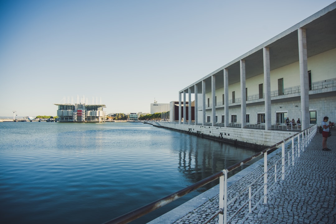 building near sea under blue sky during daytime