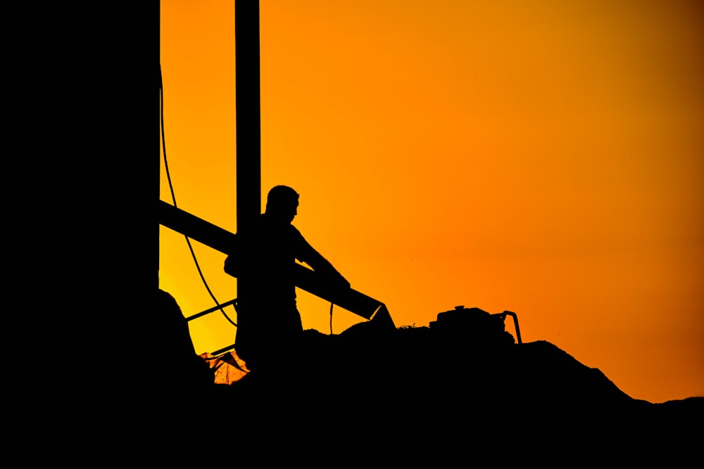 silhouette of person during golden hour