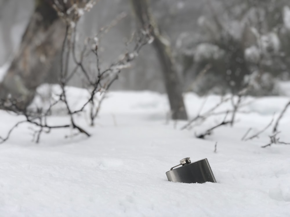 gray flask on icy surface