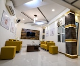 Comfortable salon waiting area with stylish furniture.