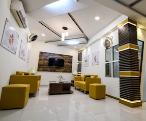 Comfortable waiting area with modern furniture and soothing colors to invite relaxation.