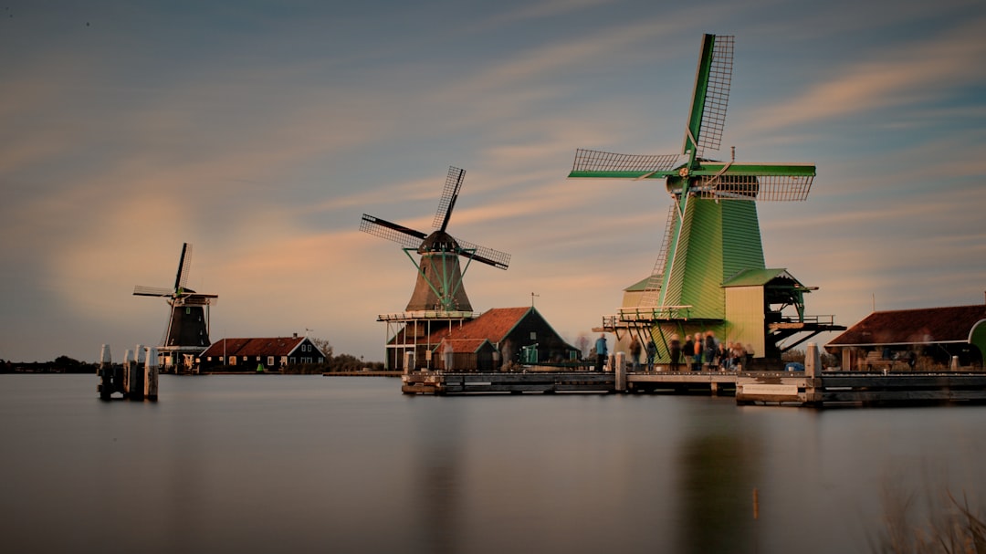 three brown and green windmills