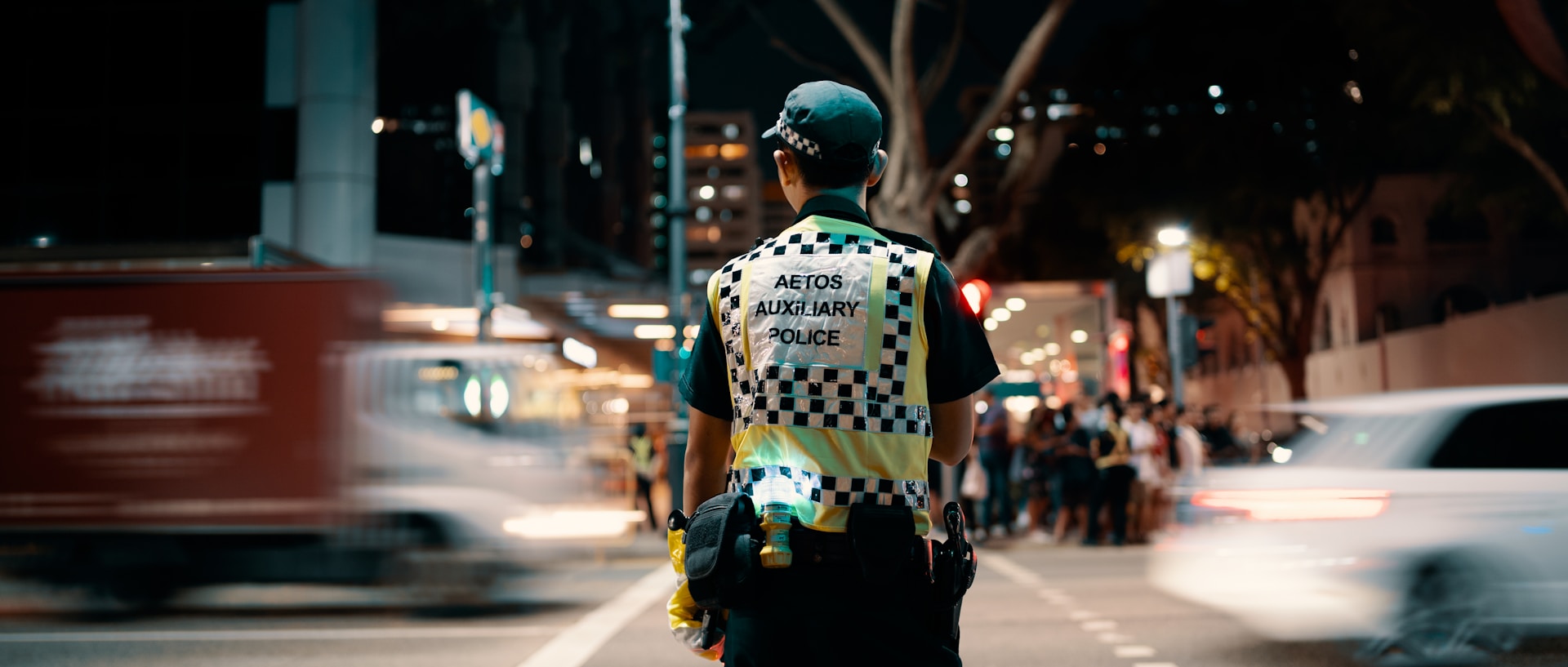 man wearing yellow vest during nighttime