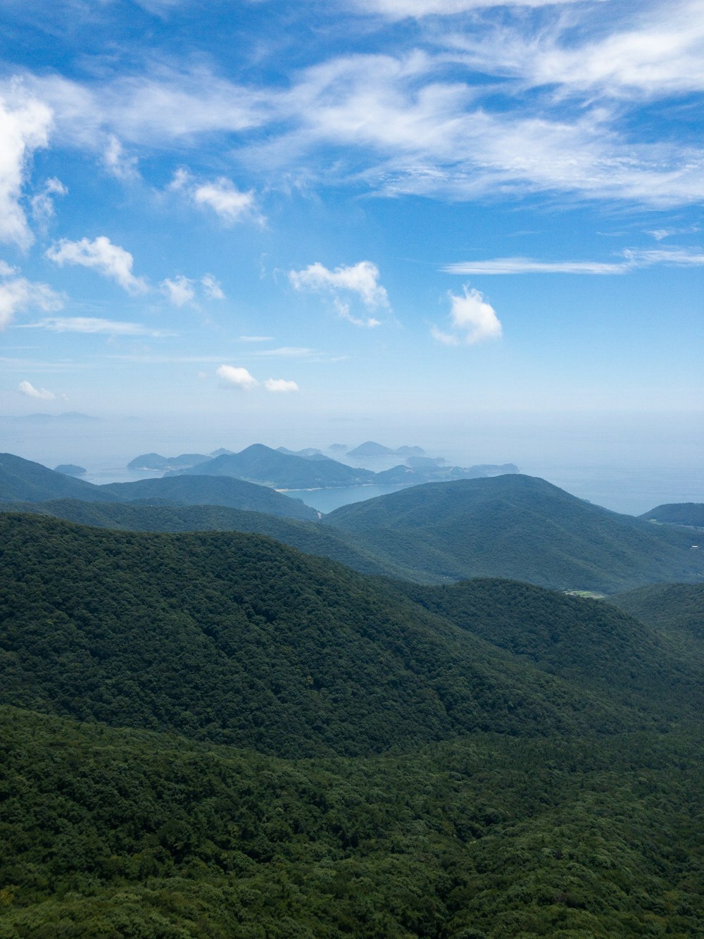 grass covered mountains during day