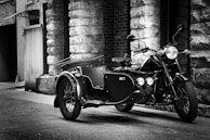 A vintage motorcycle displayed in an urban setting.