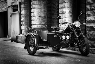 A vintage motorcycle displayed in an urban setting.