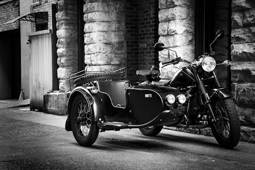 A vintage motorcycle parked in an urban setting.