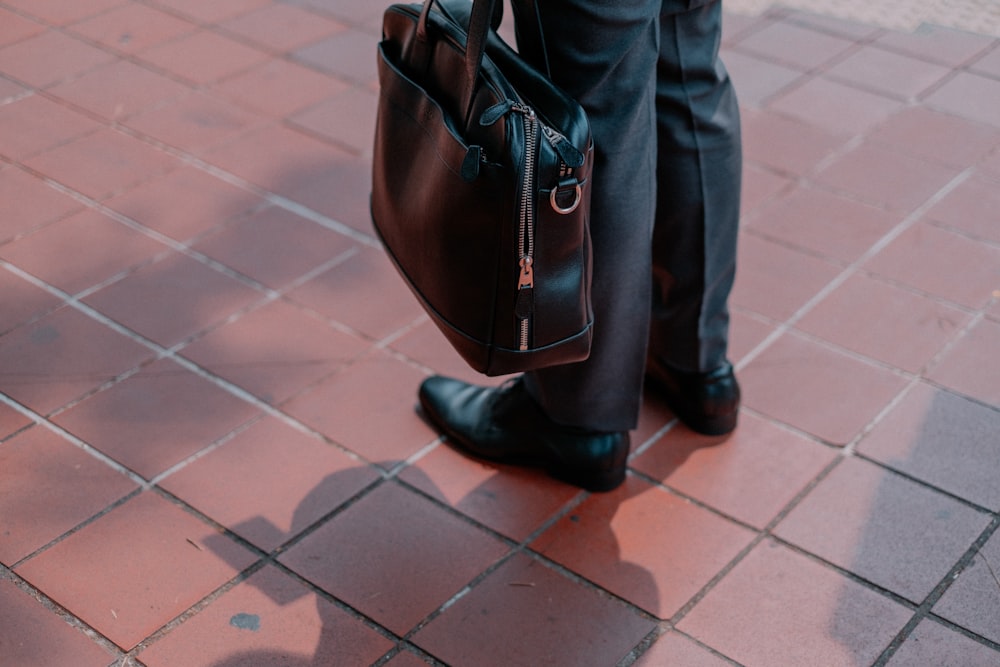 black leather bag close-up photography