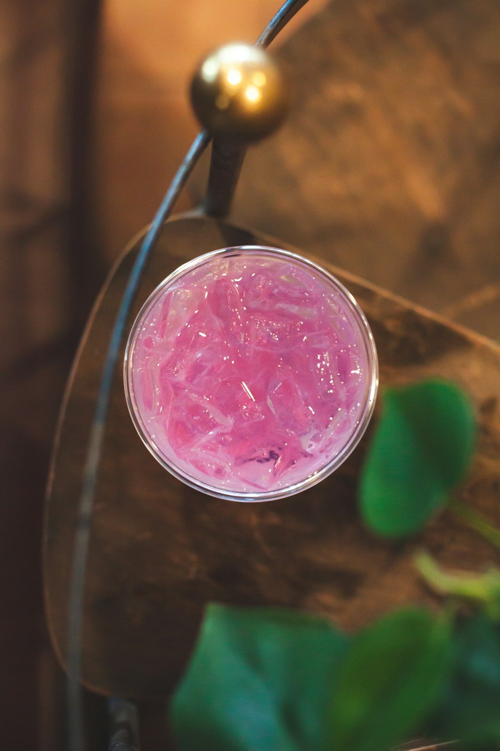 pink candle on glass surface