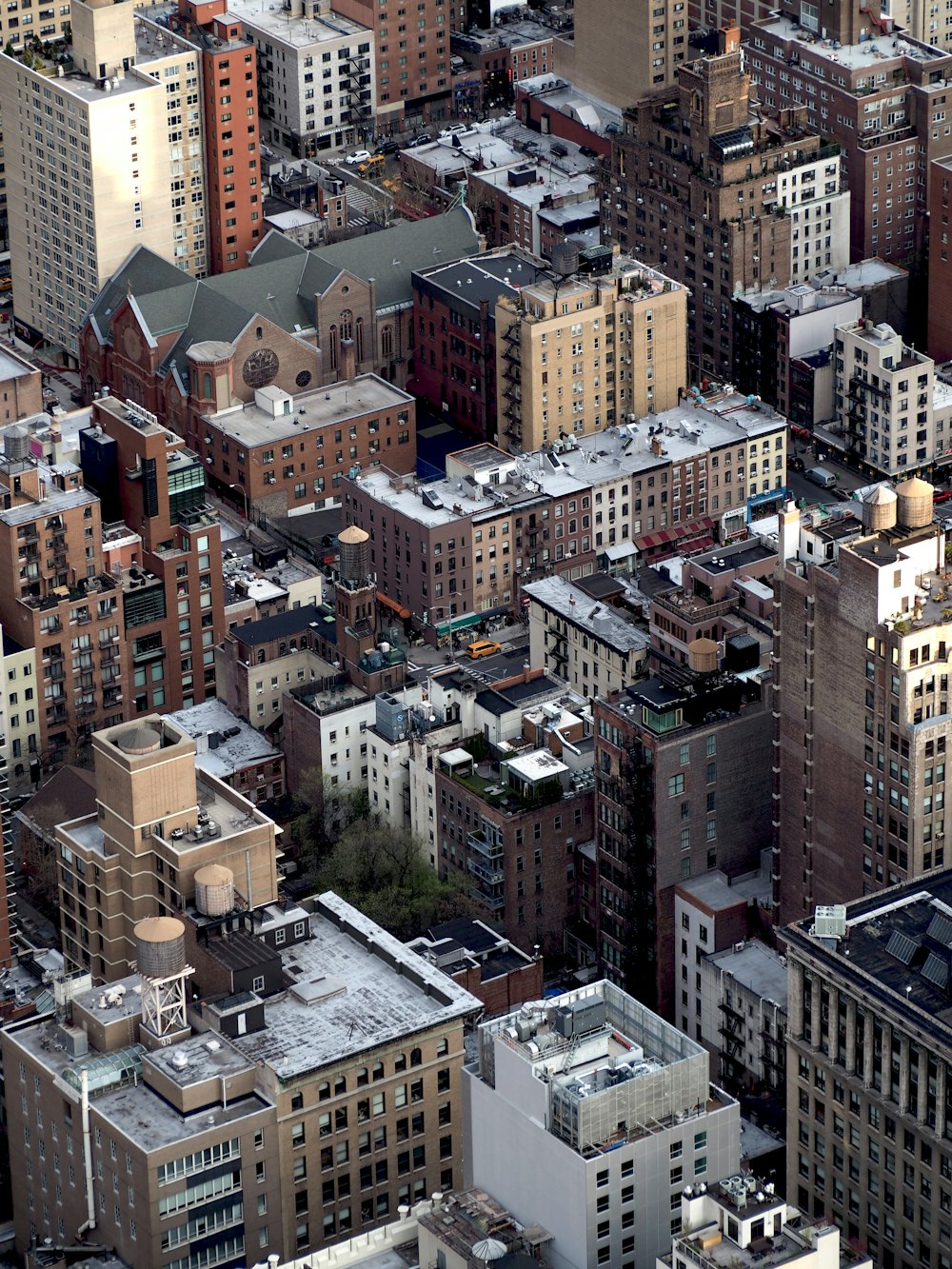 an aerial view of a city with lots of tall buildings