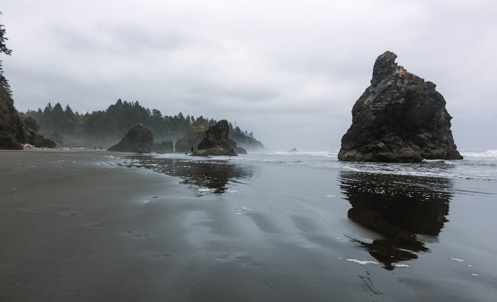 a beach that has some rocks in it