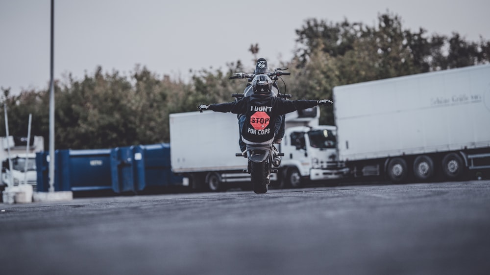 a motorcycle parked in a parking lot next to a truck