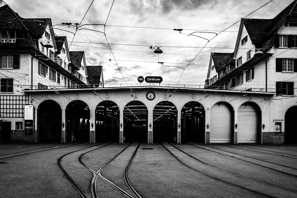 grayscale photo of train tracks