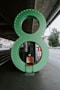 empty chair in front of green number 8 sign