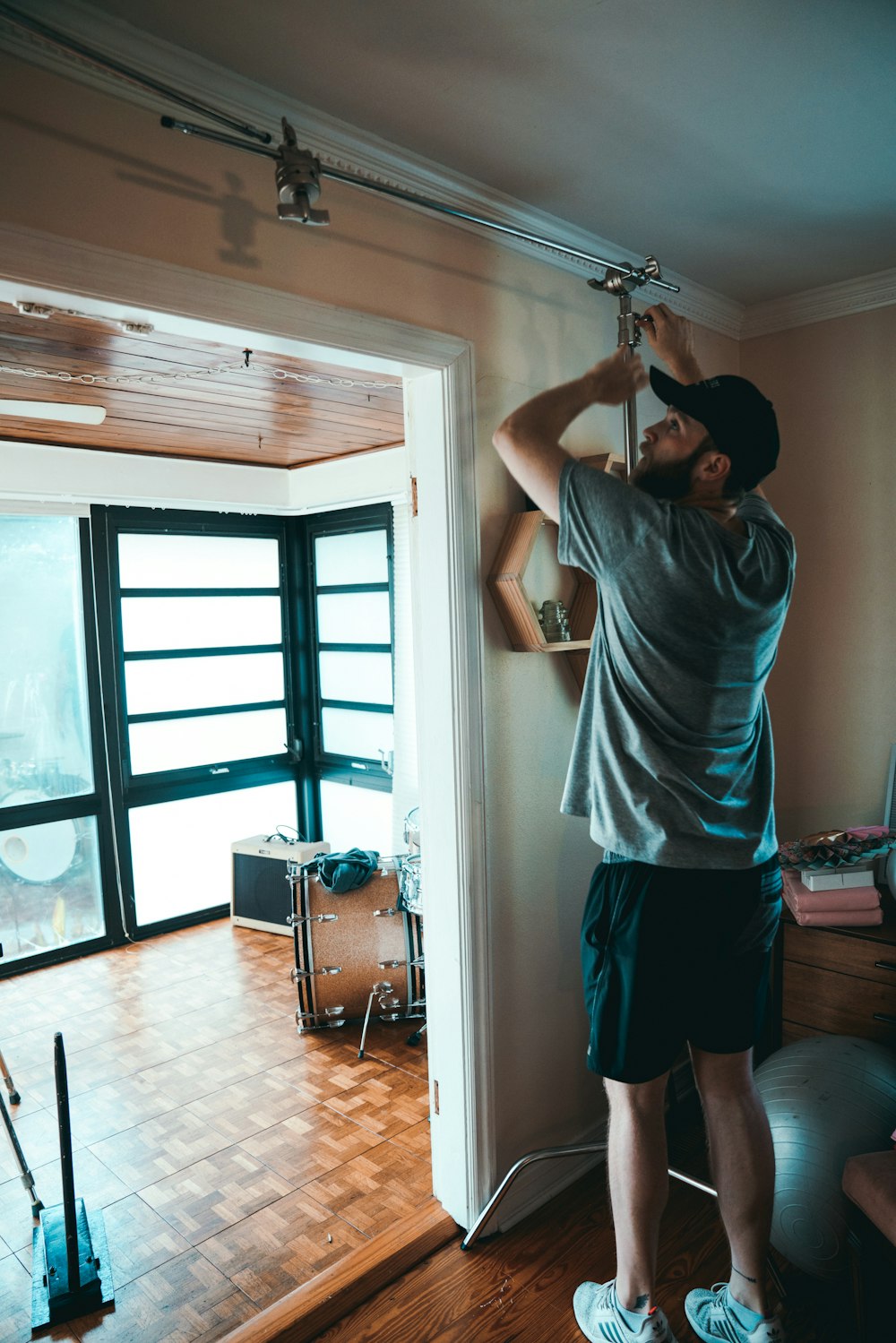 man fixing cables beside door