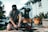 kneeling man fixing black wheeled bar