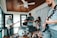 Group of musicians jamming together in a cozy studio filled with instruments.