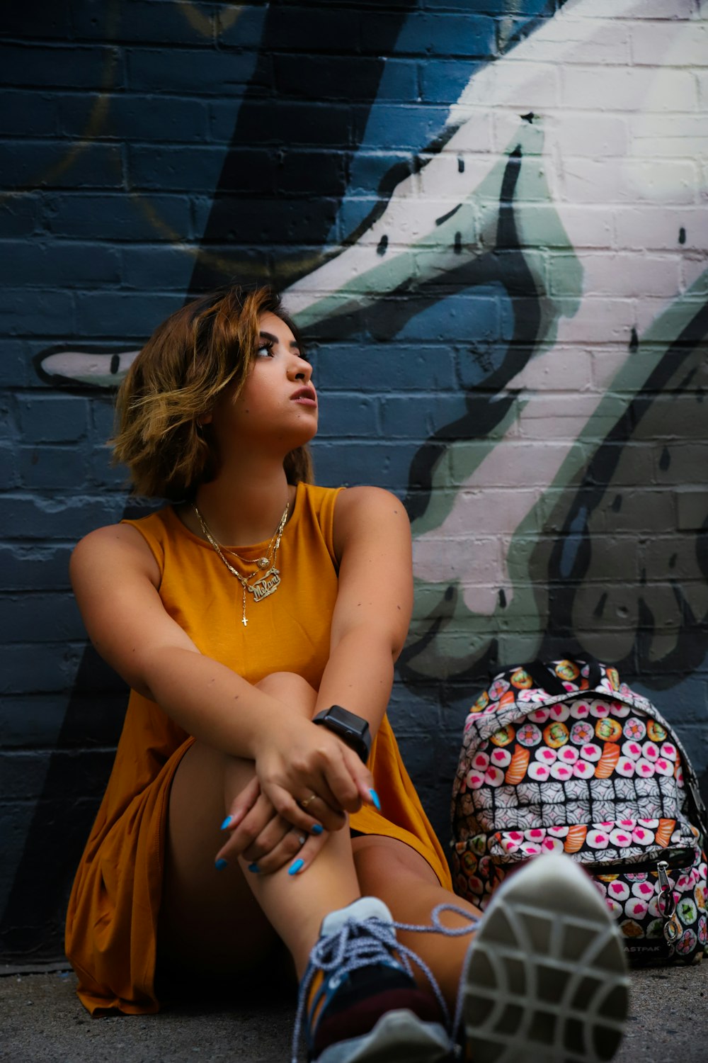 woman wears yellow tank dress