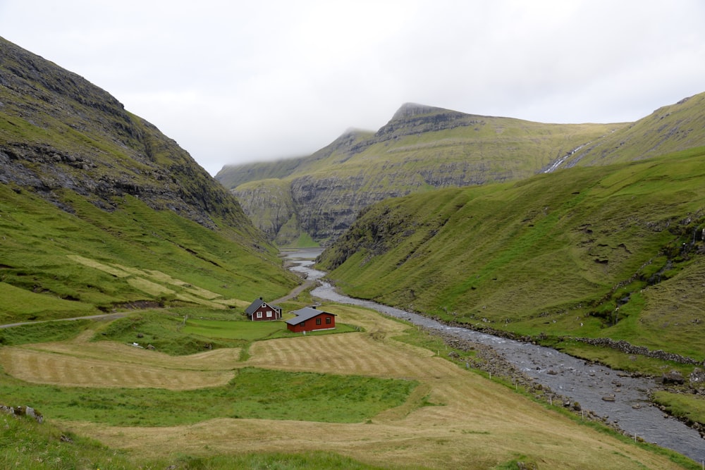 green and brown mountains under white cloud