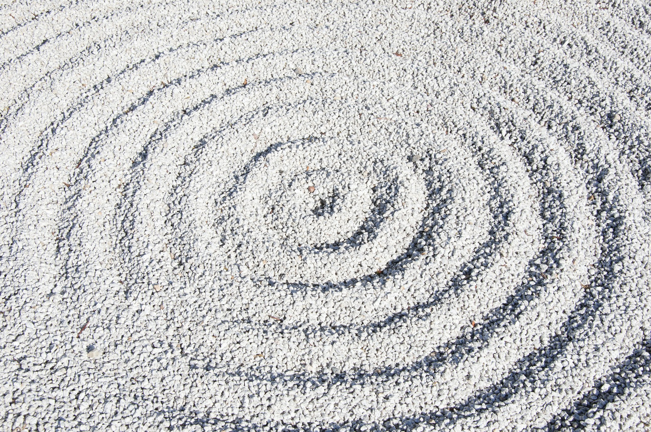 a circular lines on white sand