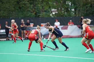 A field hockey match showcasing teamwork and competition.