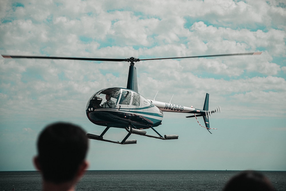 white and gray helicopter during daytime