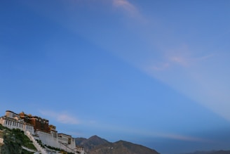 A scenic view of a famous landmark in Kazakhstan, showcasing its architectural beauty against a clear blue sky.