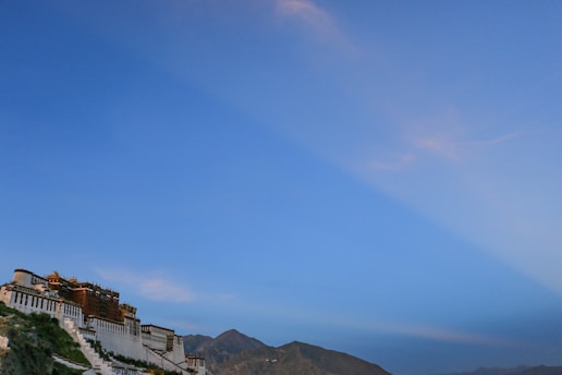 A scenic view of a famous landmark in Kazakhstan, showcasing its architectural beauty against a clear blue sky.