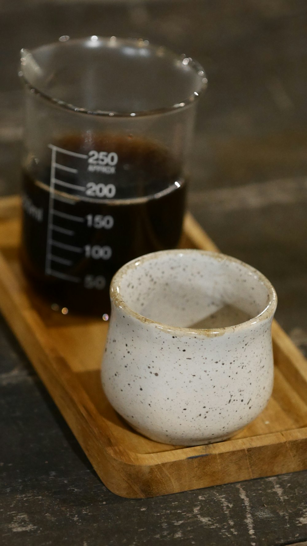 white ceramic cup on brown wooden tray