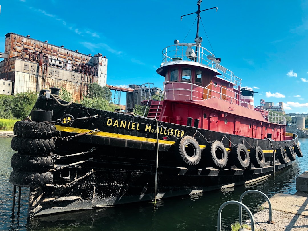 red and black Daniel McAllister boat