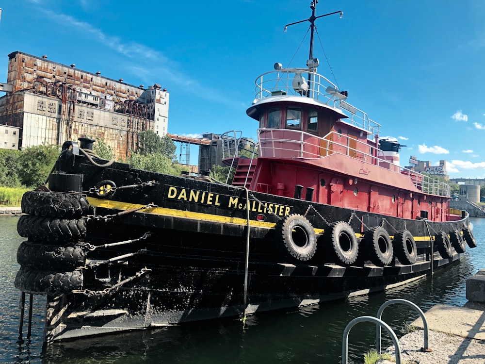 red and black Daniel McAllister boat