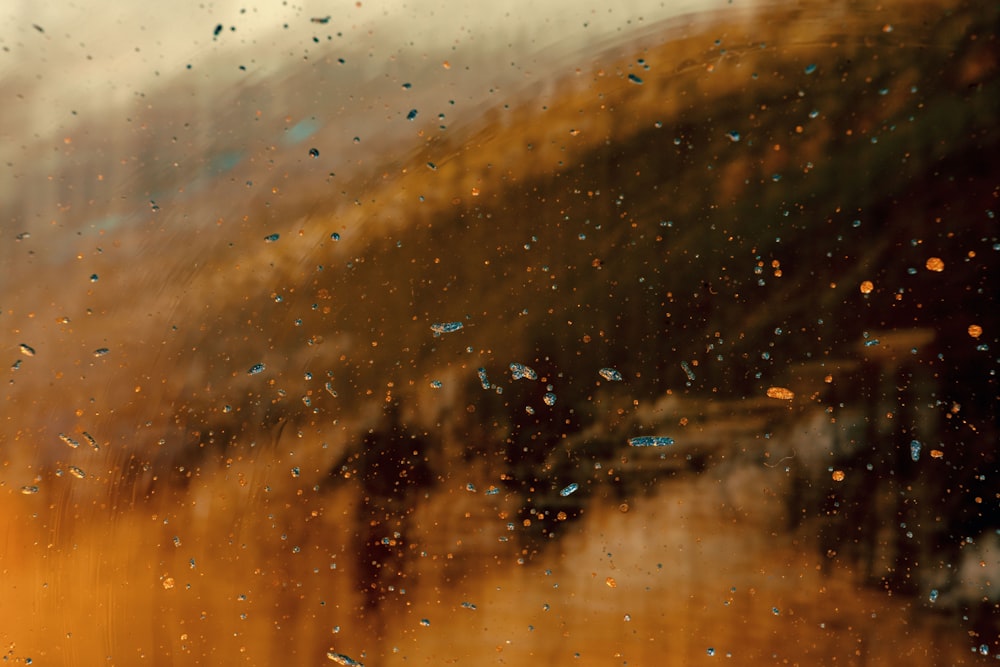 a window with rain drops on the glass