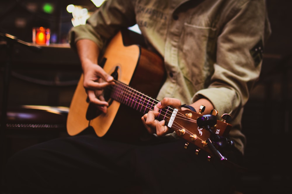 person holding guitar