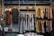 A stylish display of various fashionable clothing items arranged neatly on a wooden rack.