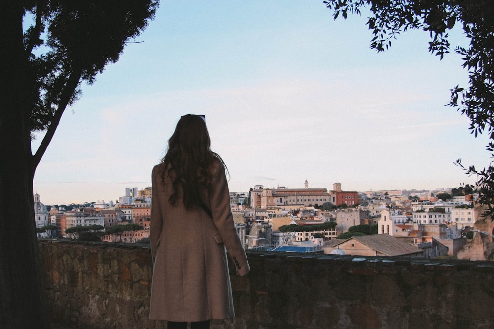 woman wearing brown coat